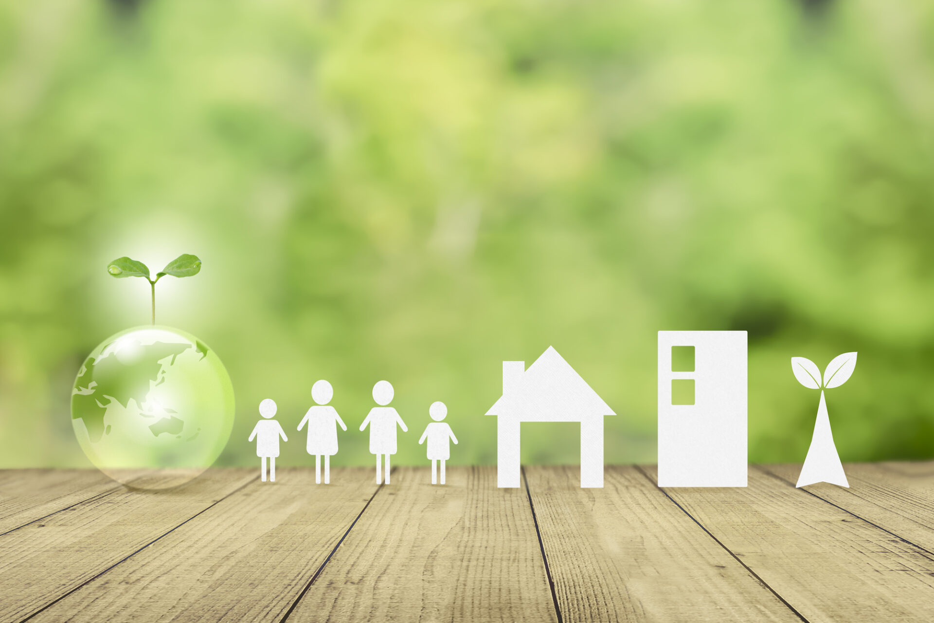 緑の背景に地球に新芽。持続可能な社会 